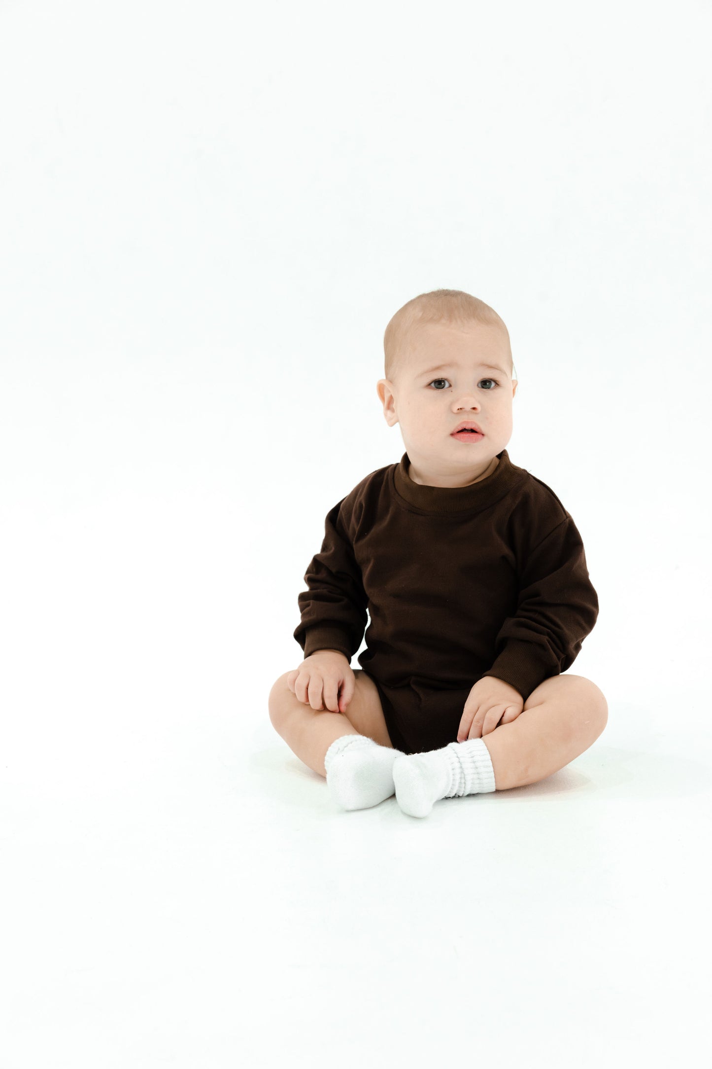 Cotton puff print romper in chocolate brown for babies and toddlers with puff print logo