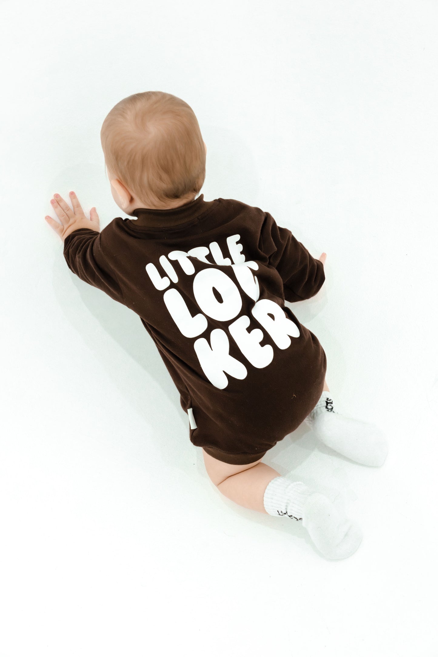 Cotton puff print romper in chocolate brown for babies and toddlers with puff print logo