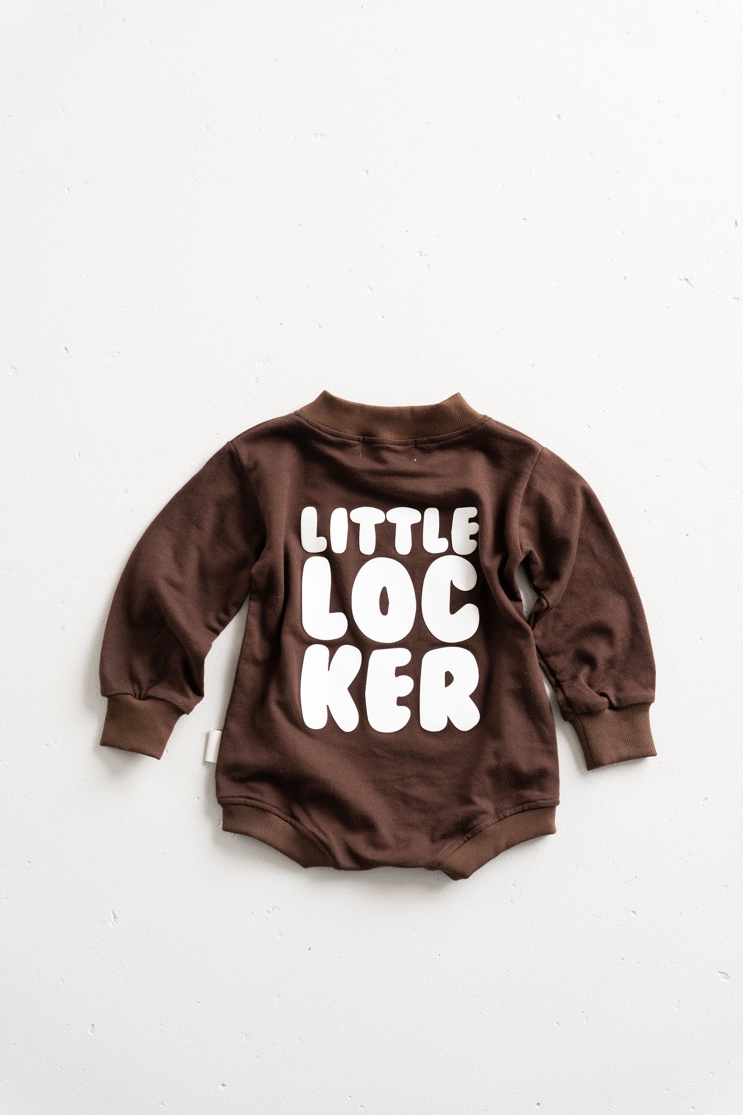 Cotton puff print romper in chocolate brown for babies and toddlers with puff print logo