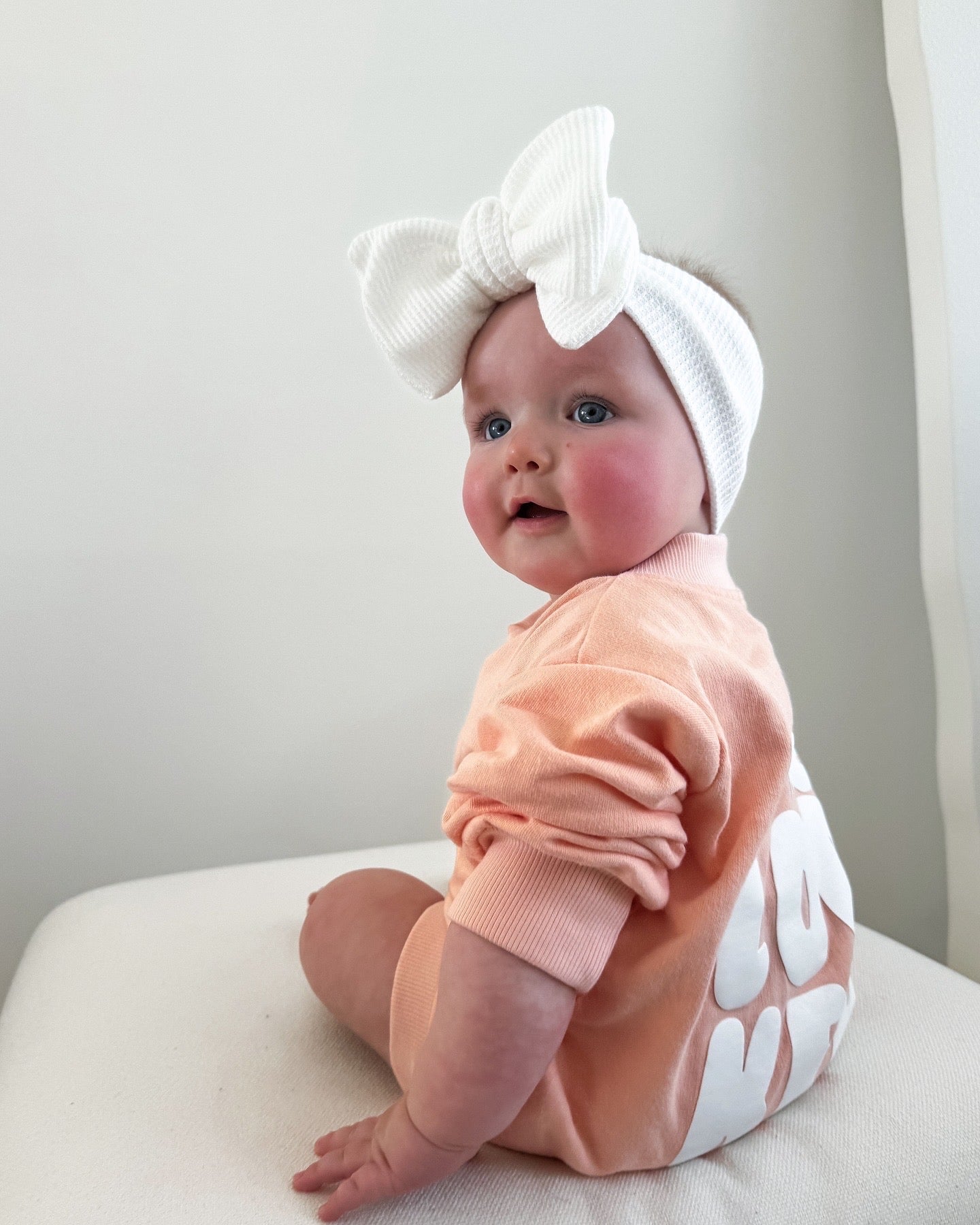 Cotton puff print romper in musk pink for babies and toddlers with puff print logo