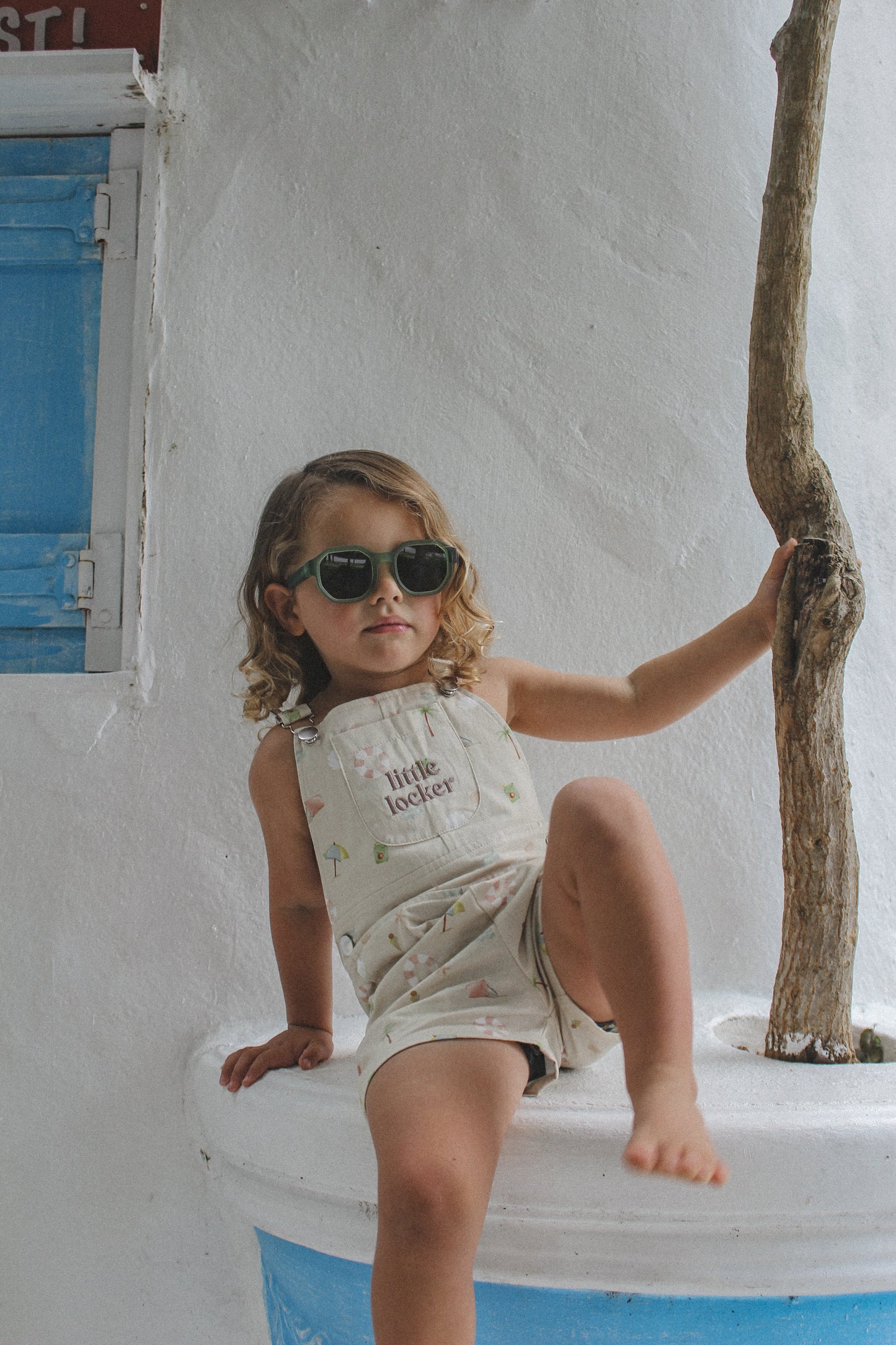 Ethically made gender-neutral summer overall with beach-inspired print