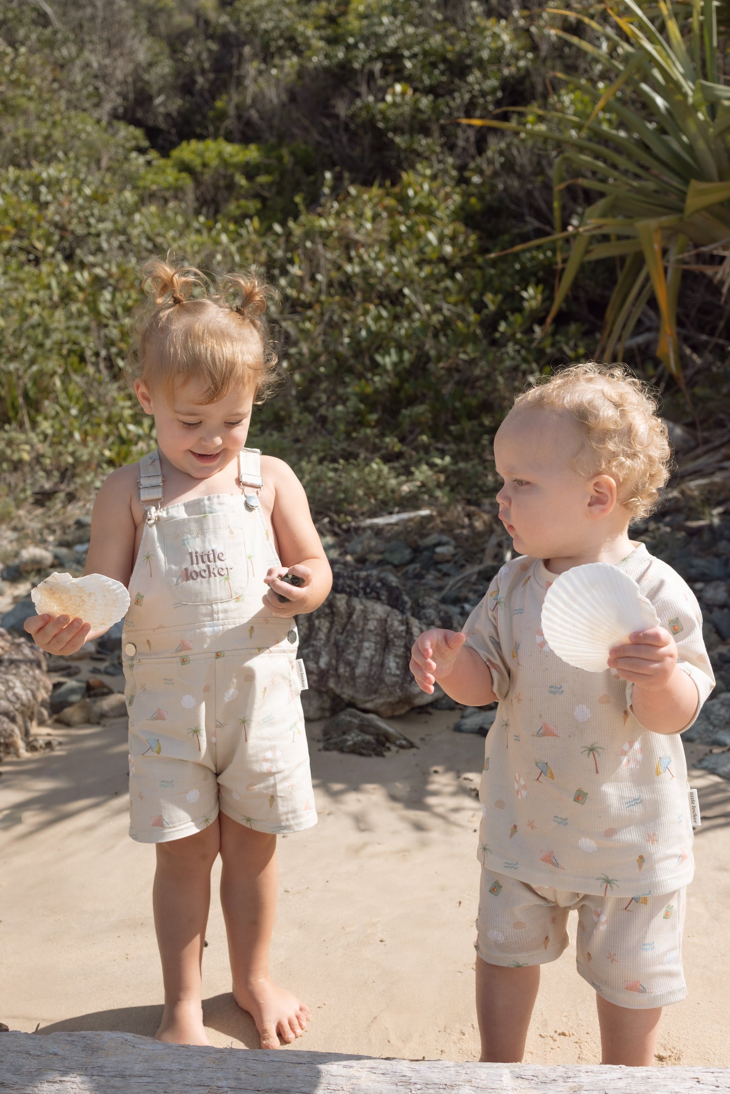 Ethically made gender-neutral summer overall with beach-inspired print