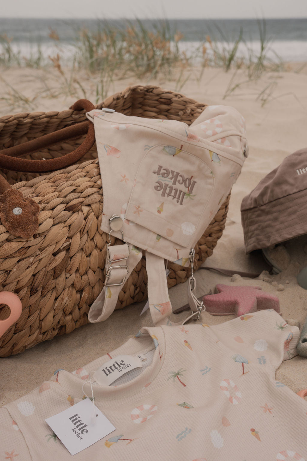 Ethically made gender-neutral summer overall with beach-inspired print