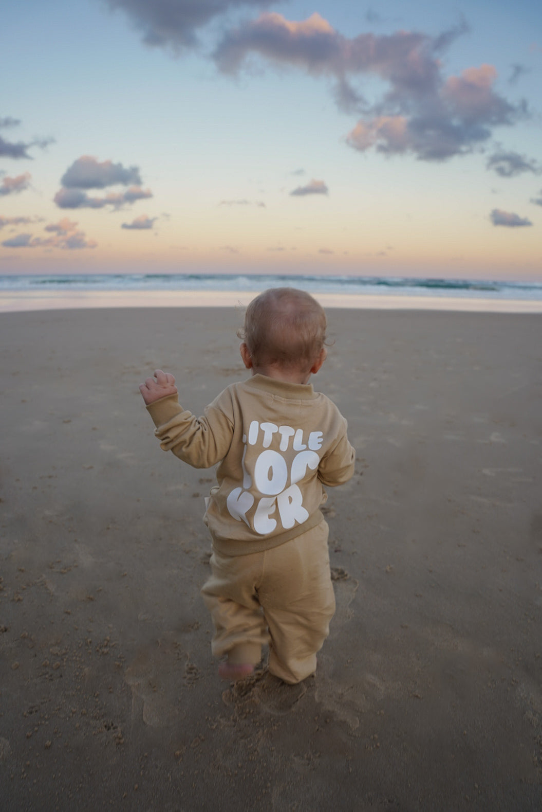 Neutral latte puff print track set for babies, toddler and kids. Made from soft cotton with relaxed fit and puff print logo