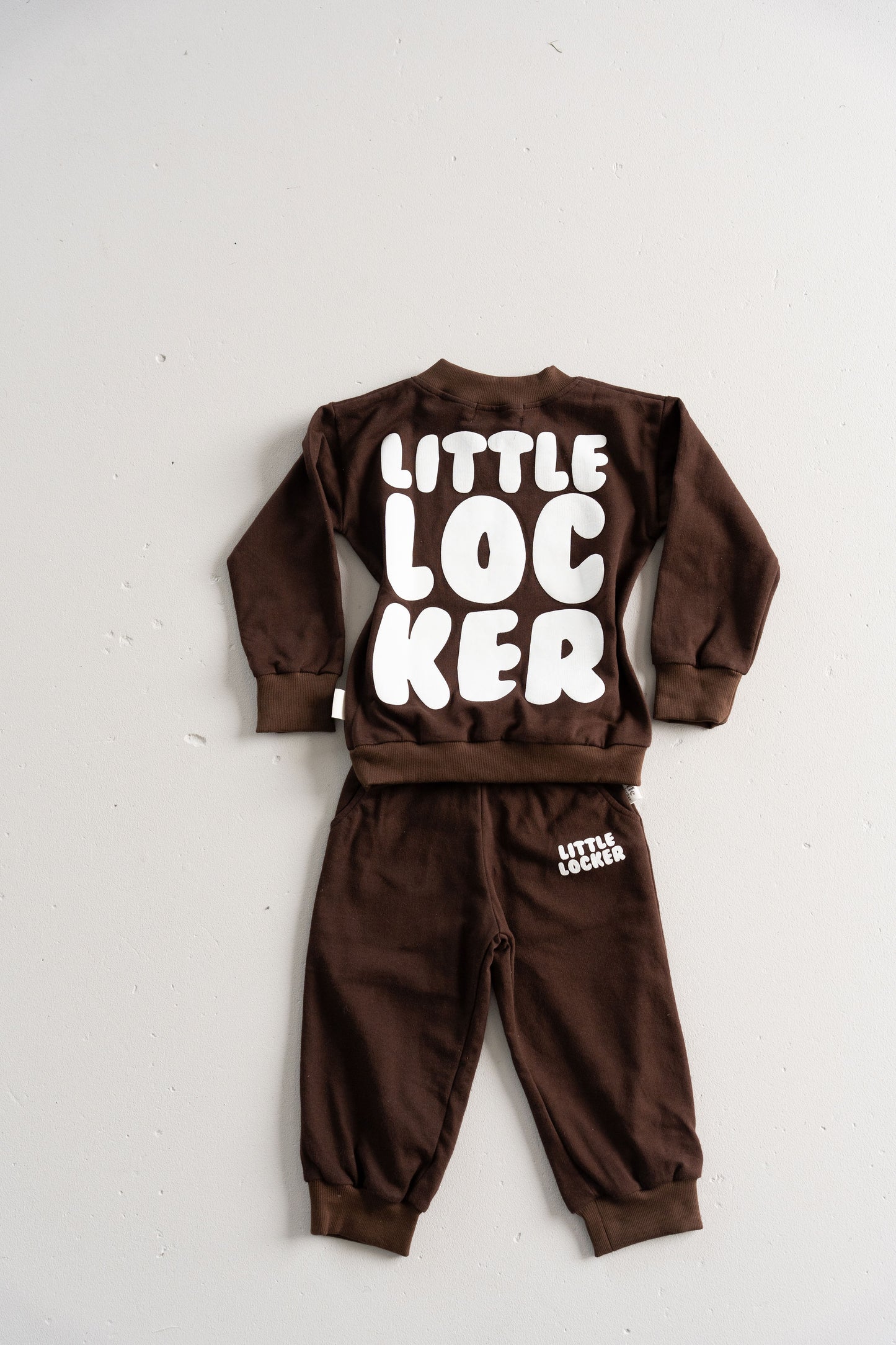 Neutral latte puff print track set for babies, toddler and kids. Made from soft cotton with relaxed fit and puff print logo