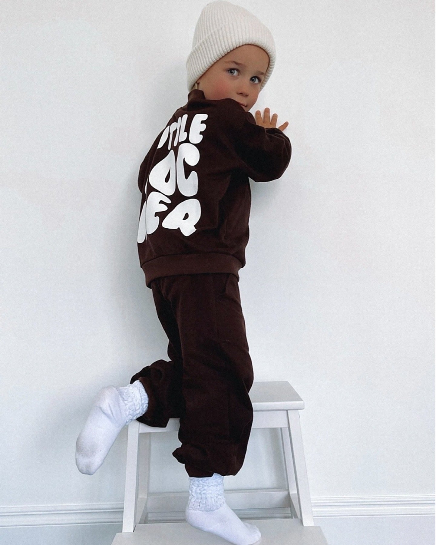 Neutral latte puff print track set for babies, toddler and kids. Made from soft cotton with relaxed fit and puff print logo