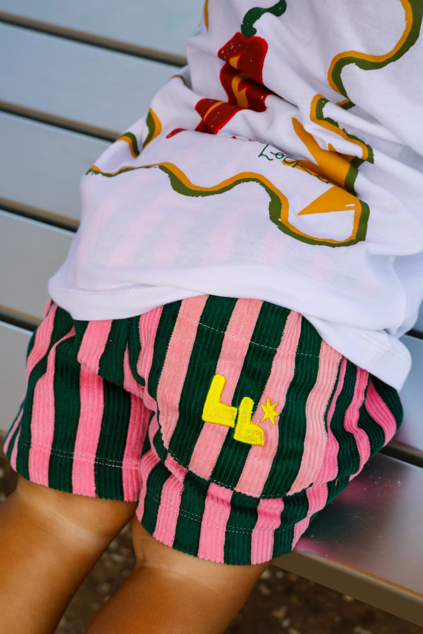 Green and Pink bright striped corduroy 'Zinger' shorts by Little Locker with back pocket embroidery.