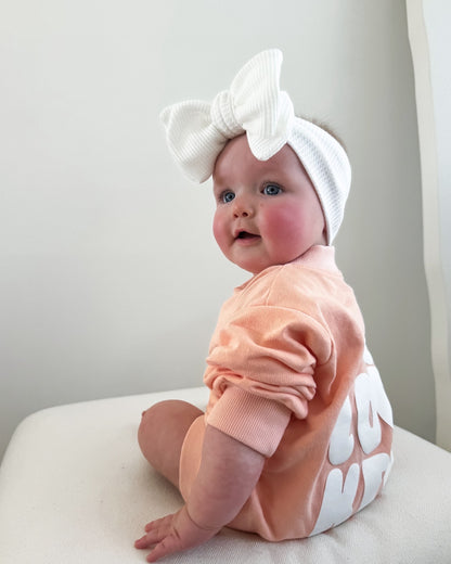 Cotton puff print romper in musk pink for babies and toddlers with puff print logo