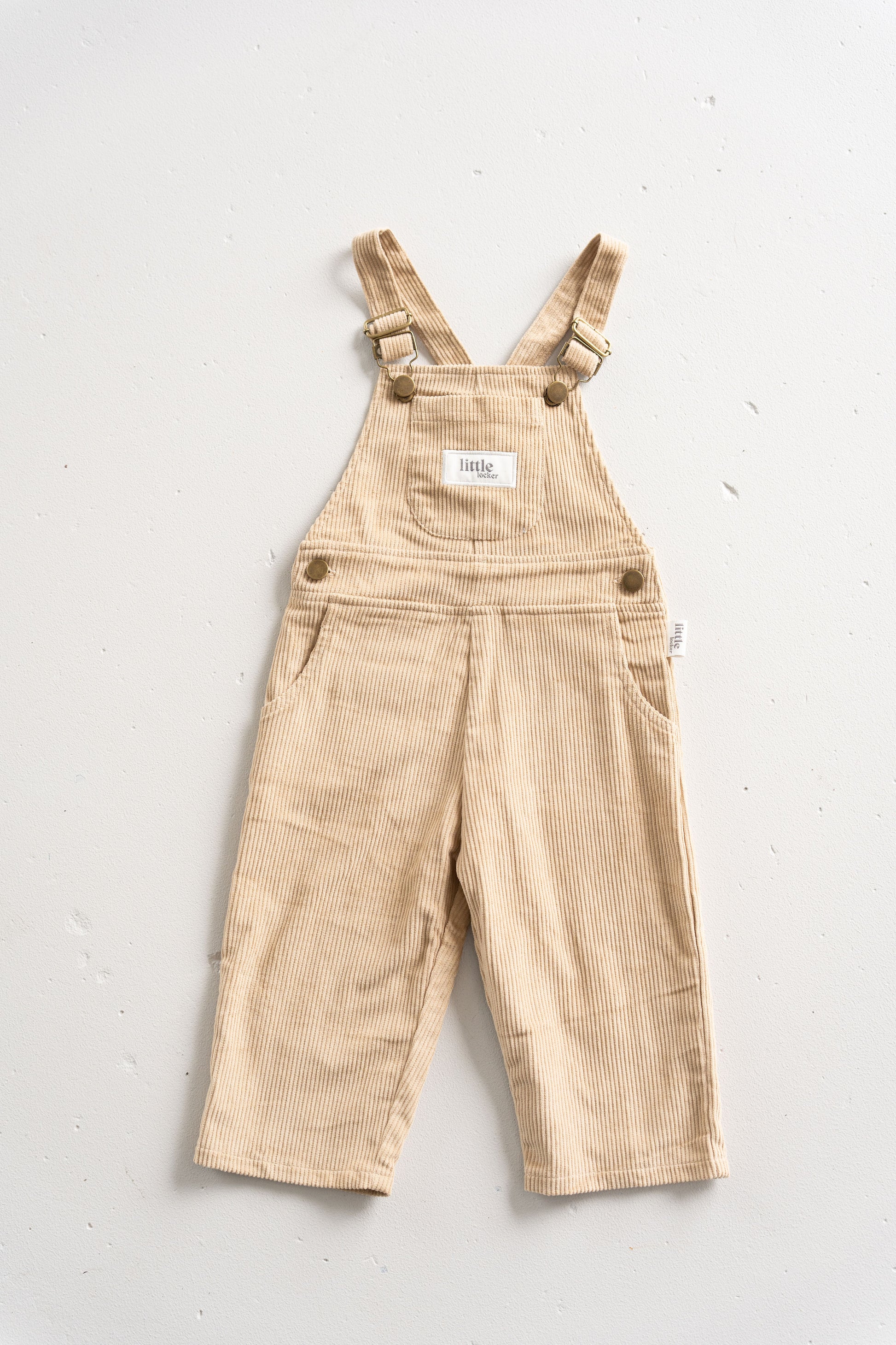 Latte Neutral Corduroy overall for babies, toddlers and kids. Made from soft cotton with adjustable straps and a relaxed fit.
