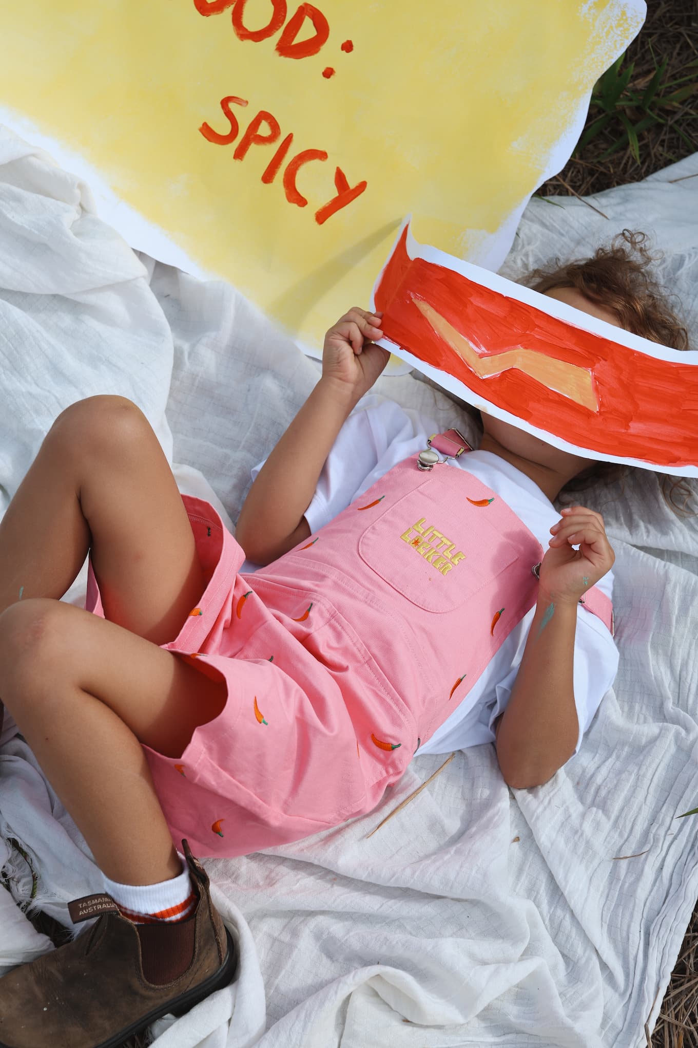 Bright pink Little Locker kids cotton overalls with chilli pepper embroidery.