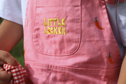 Bright pink cotton overalls with chilli pepper embroidery and embroidered Little Locker logo.