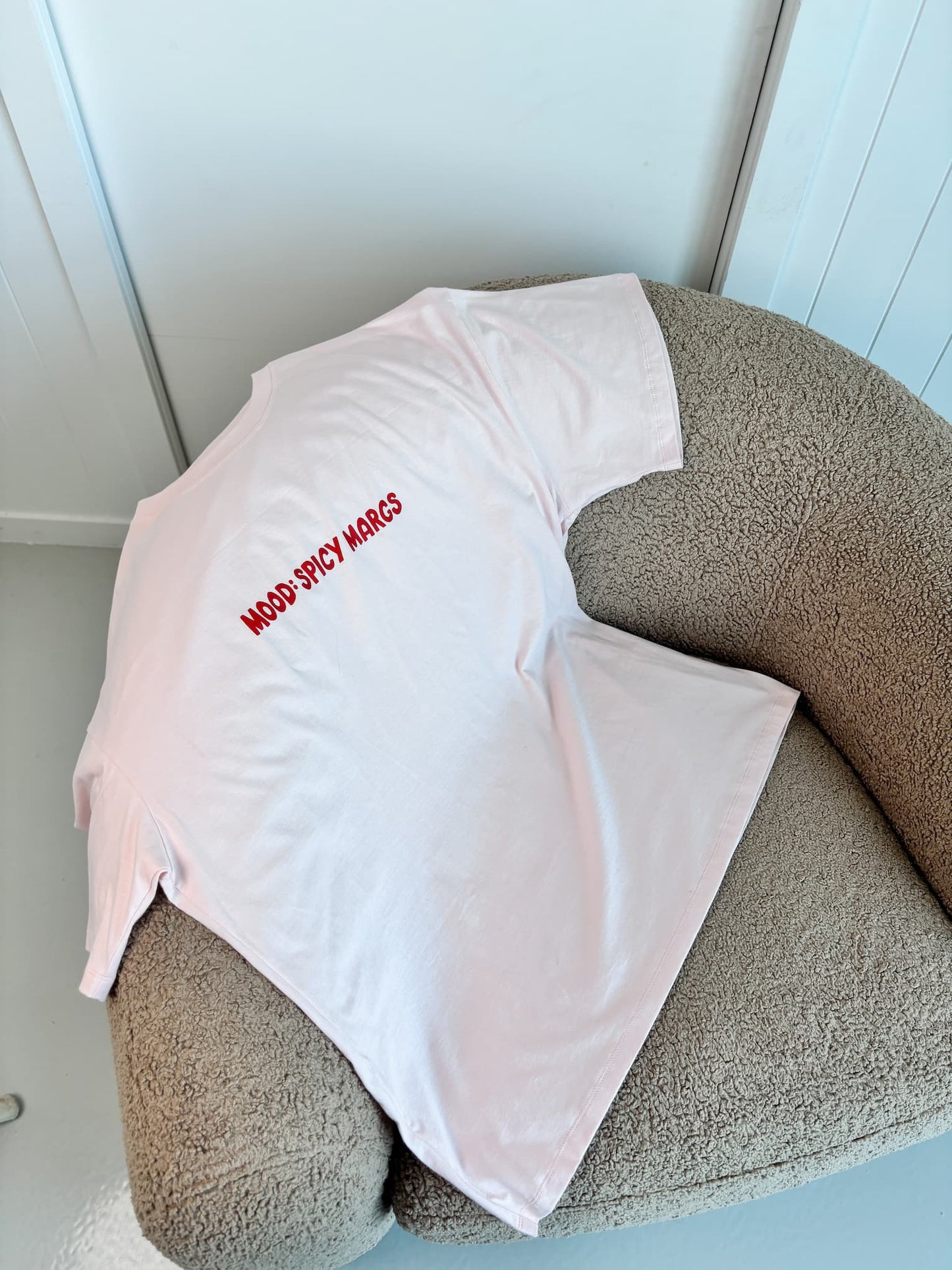 Front view of the pink women's oversized tee, highlighting the soft, buttery 100% combed cotton fabric and flattering drape.