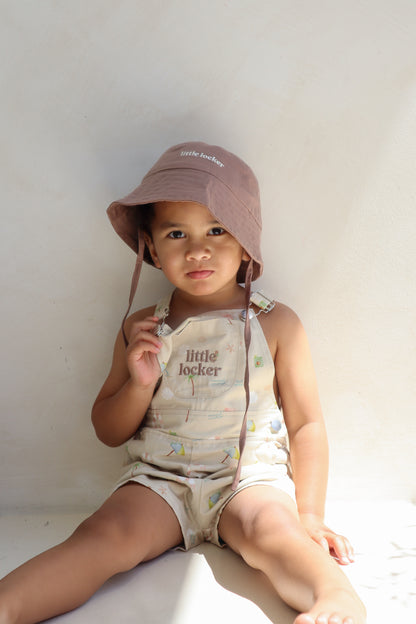 Ethically made gender-neutral summer overall with beach-inspired print