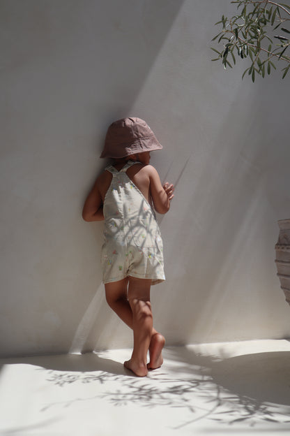 Ethically made gender-neutral summer overall with beach-inspired print