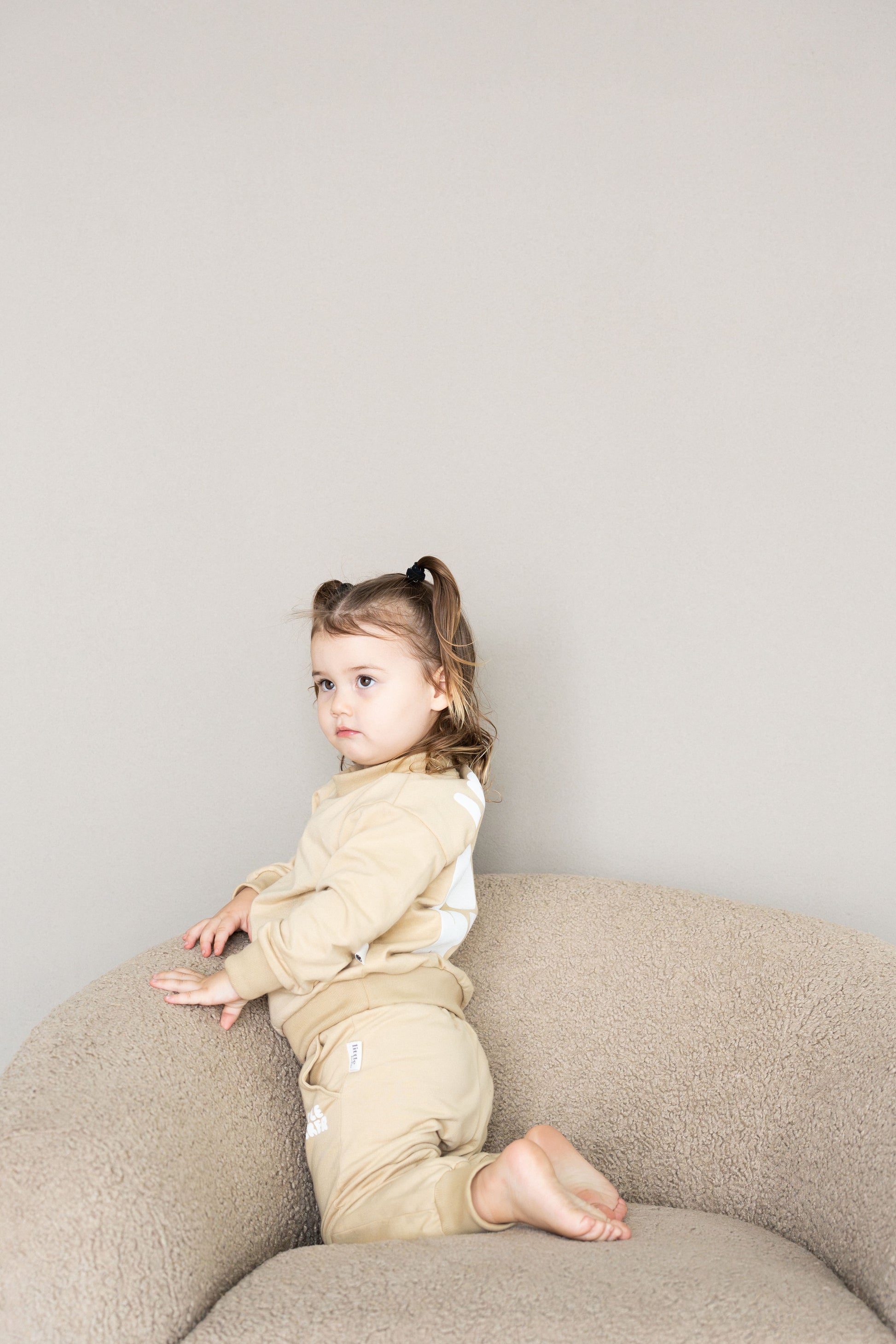 Neutral latte puff print track set for babies, toddler and kids. Made from soft cotton with relaxed fit and puff print logo